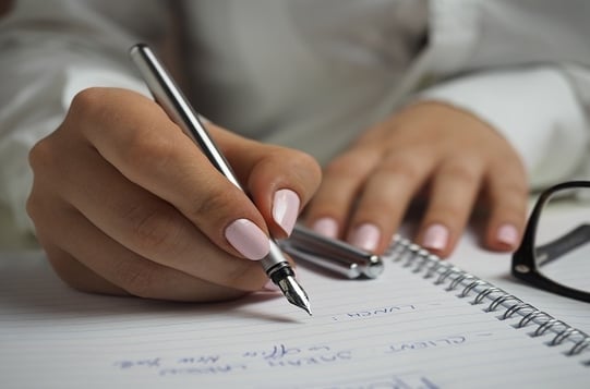 Financial manager writing tips on property investment 